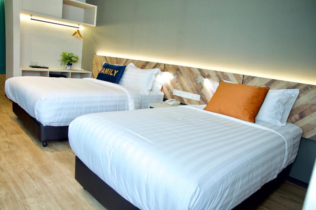 Postel nebo postele na pokoji v ubytování G5 HOTEL AND SERVICED APARTMENT