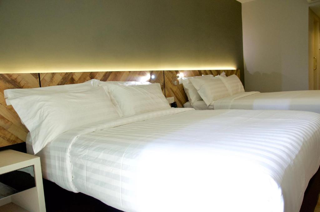 Postel nebo postele na pokoji v ubytování G5 HOTEL AND SERVICED APARTMENT