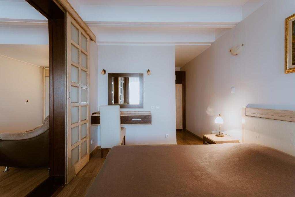 Ліжко або ліжка в номері Medical and Spa Centre Merkur