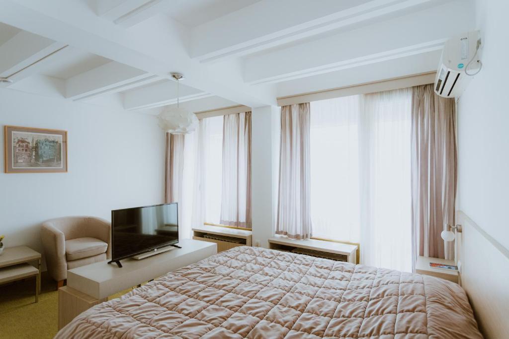 Ліжко або ліжка в номері Medical and Spa Centre Merkur