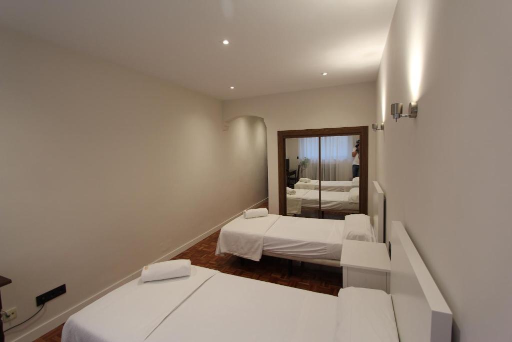 Postel nebo postele na pokoji v ubytování Hotel Castellano Centro