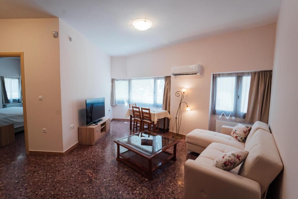 a living room with a couch and a table at Luxury Apartment in Plaka - Acropolis (Rosemary) in Athens