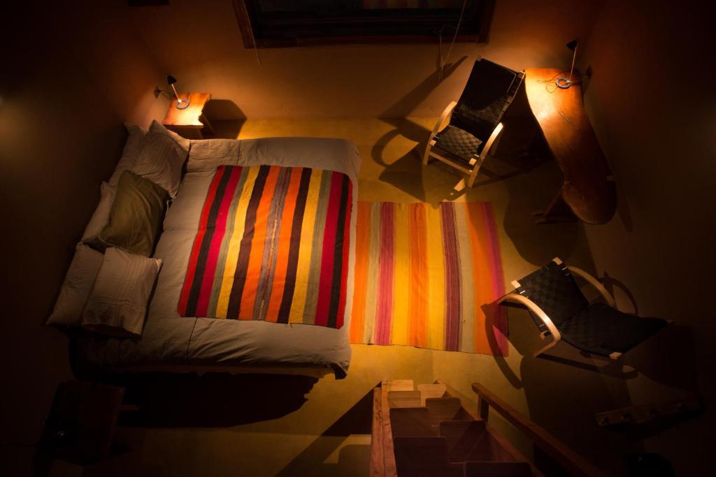 Postel nebo postele na pokoji v ubytování Planeta Atacama Lodge