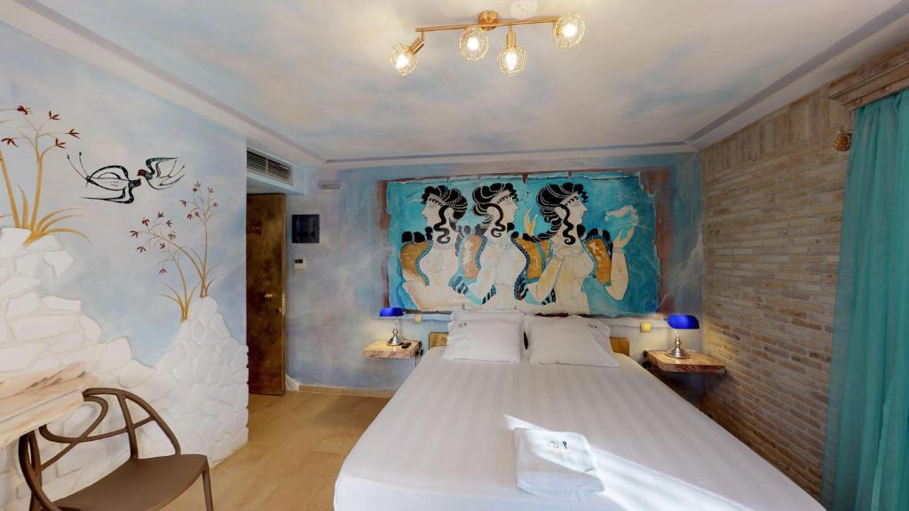 Postel nebo postele na pokoji v ubytování Leda Suites