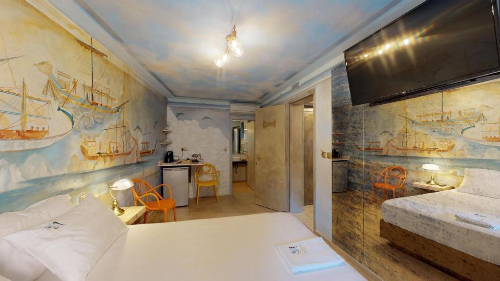 Postel nebo postele na pokoji v ubytování Leda Suites