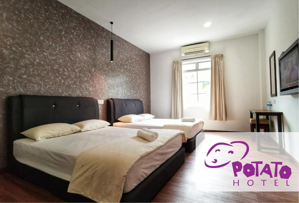 Postel nebo postele na pokoji v ubytování Potato Hotel