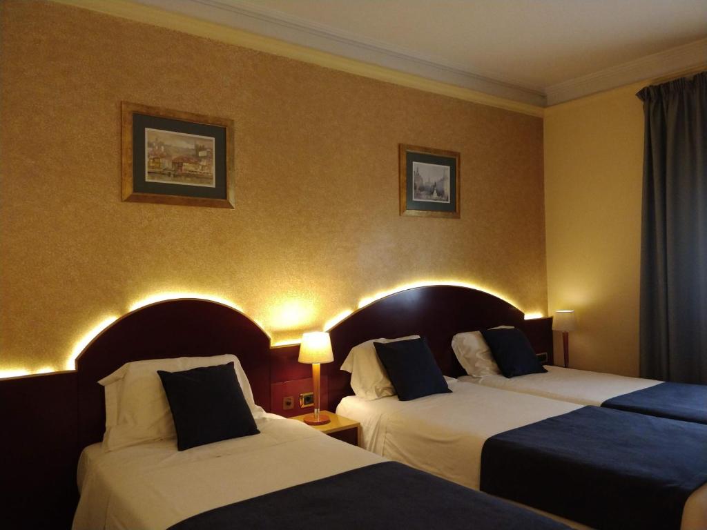 Cama ou camas em um quarto em Hotel Internacional Porto