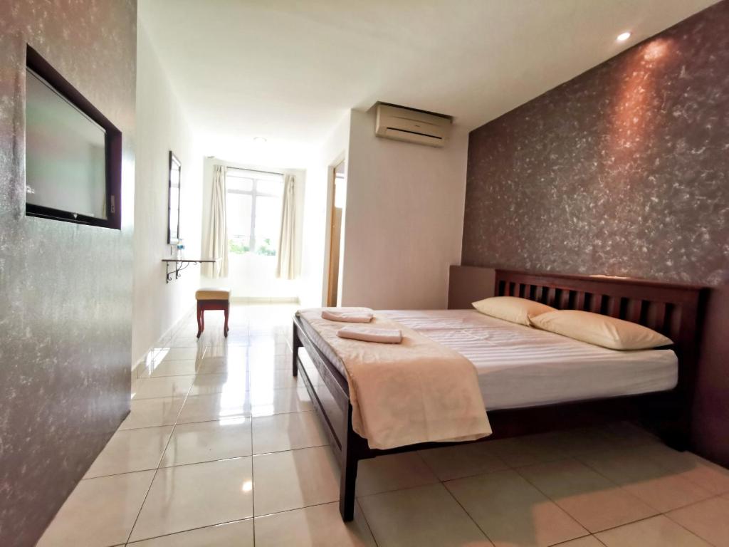 Postel nebo postele na pokoji v ubytování Potato Hotel