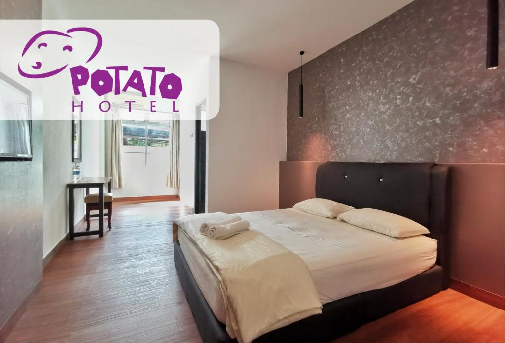 Postel nebo postele na pokoji v ubytování Potato Hotel
