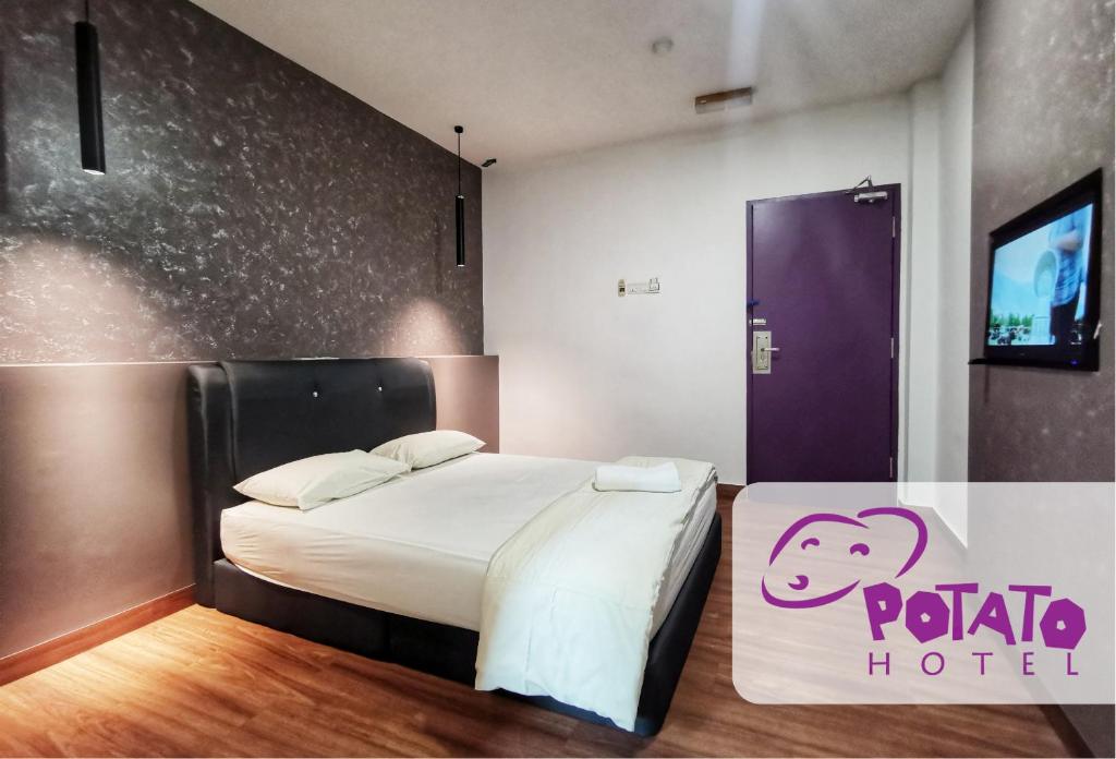 Postel nebo postele na pokoji v ubytování Potato Hotel