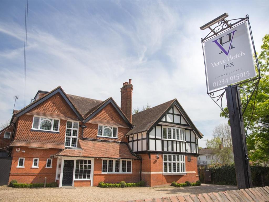 a house with a sign in front of it at Verve Hotel in Bedford