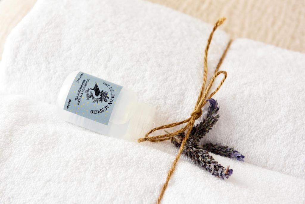 a bottle of milk sitting on top of a white towel at Arya Nobile Dimora in Carovigno
