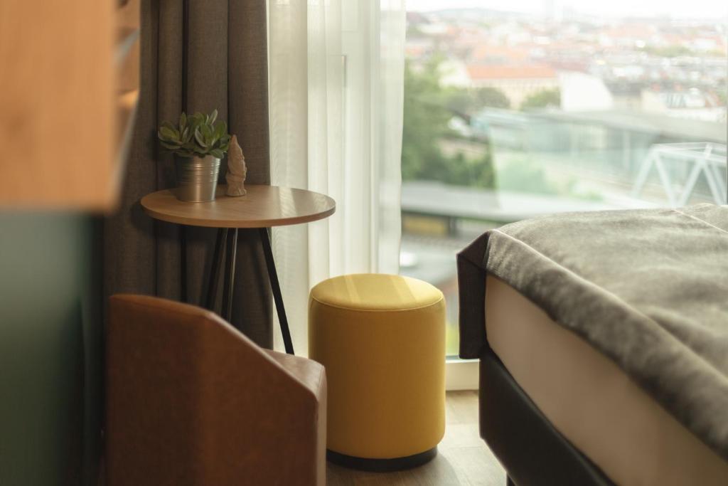 Postel nebo postele na pokoji v ubytování Holiday Inn - the niu, Dwarf Berlin Schöneberg by IHG
