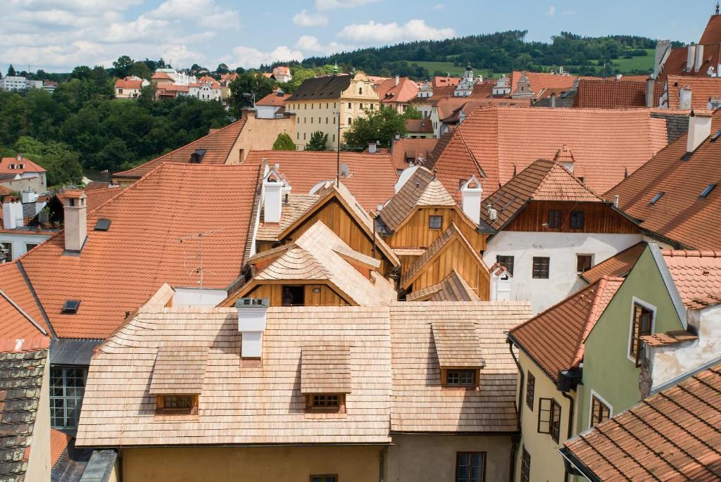a view of roofs of houses in a town at Hotel U Malého Vitka in Český Krumlov
