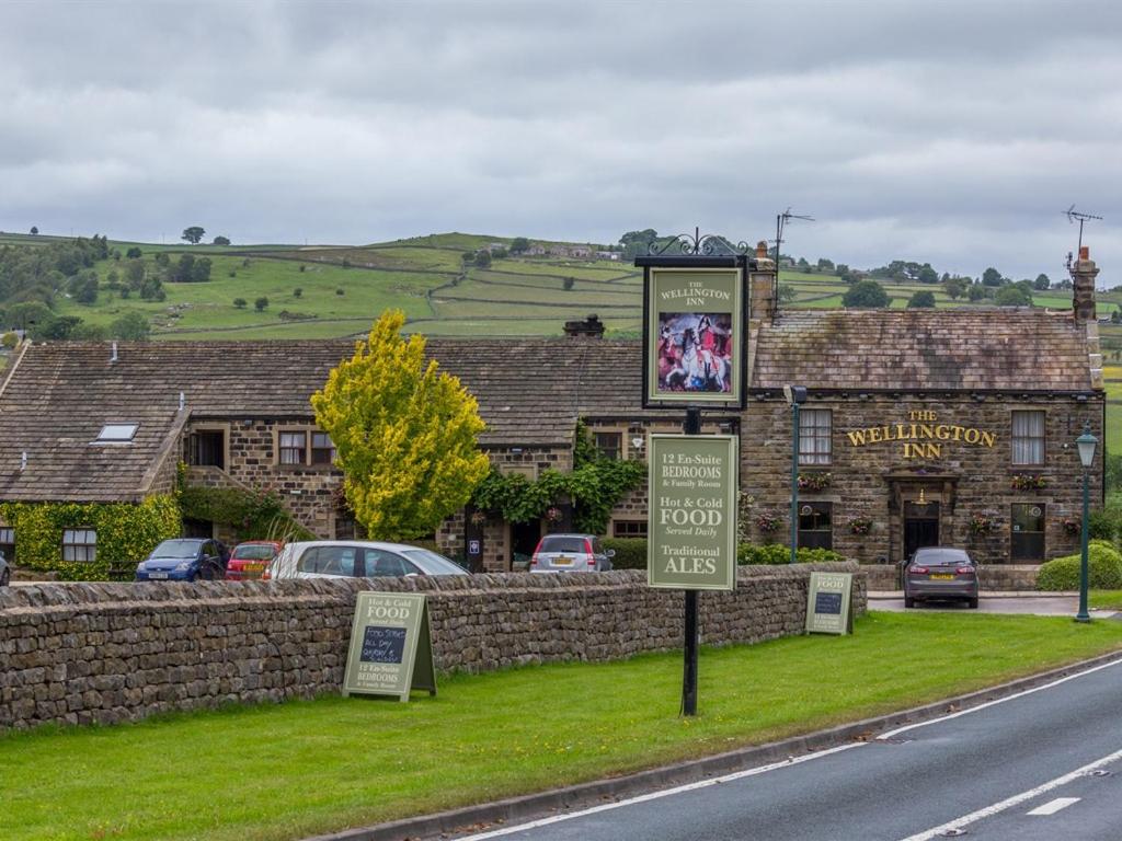 a building on the side of a road with a sign at Wellington Inn in Harrogate