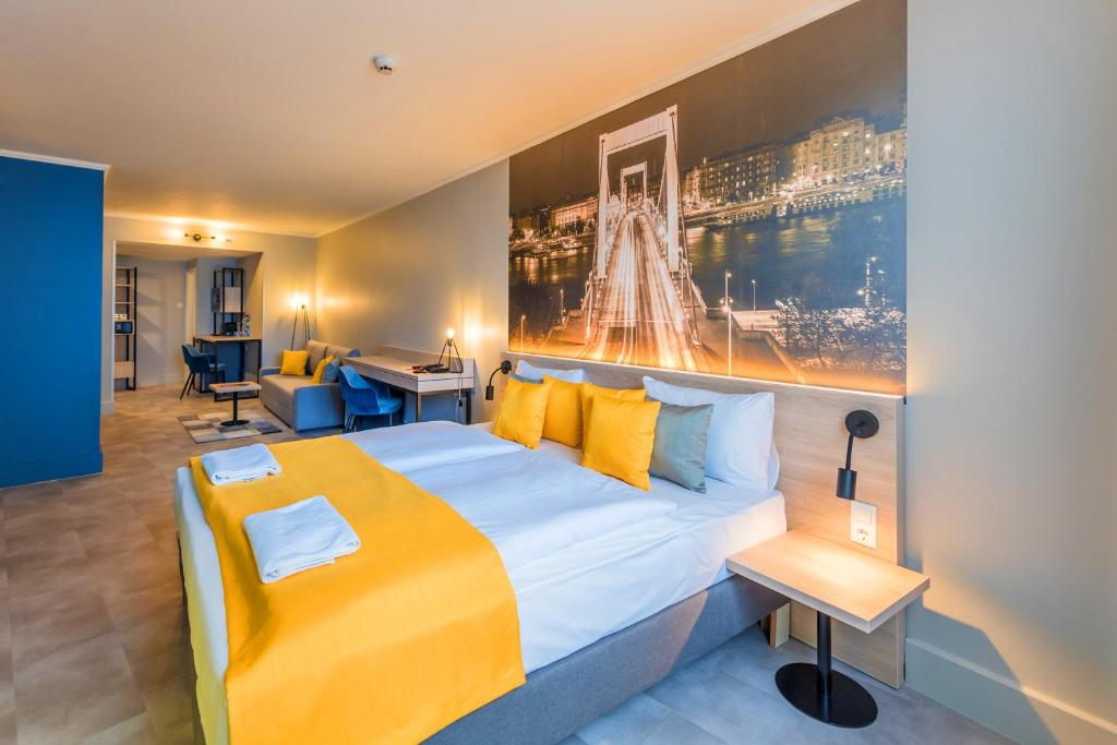 Postel nebo postele na pokoji v ubytování Impulso Fashion Hotel