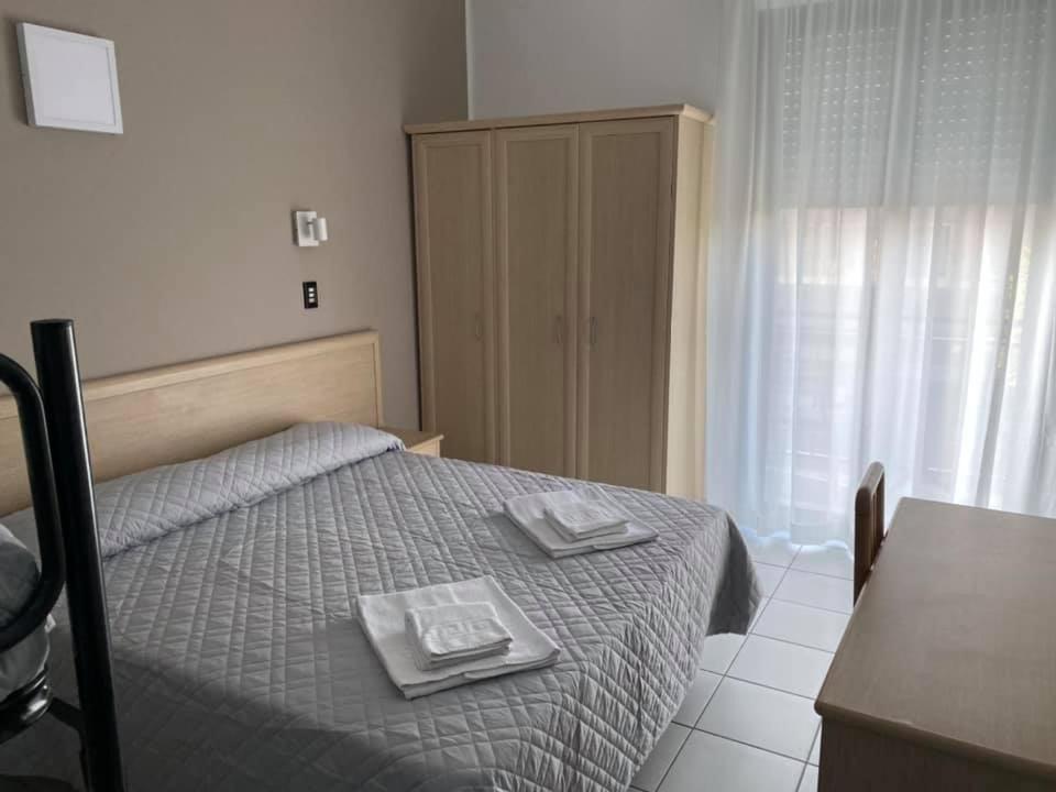 A bed or beds in a room at Hotel Rex