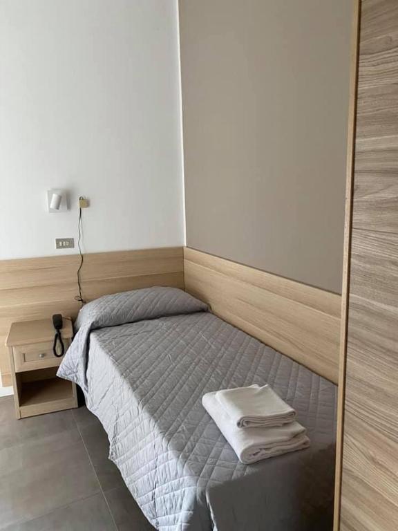 A bed or beds in a room at Hotel Rex
