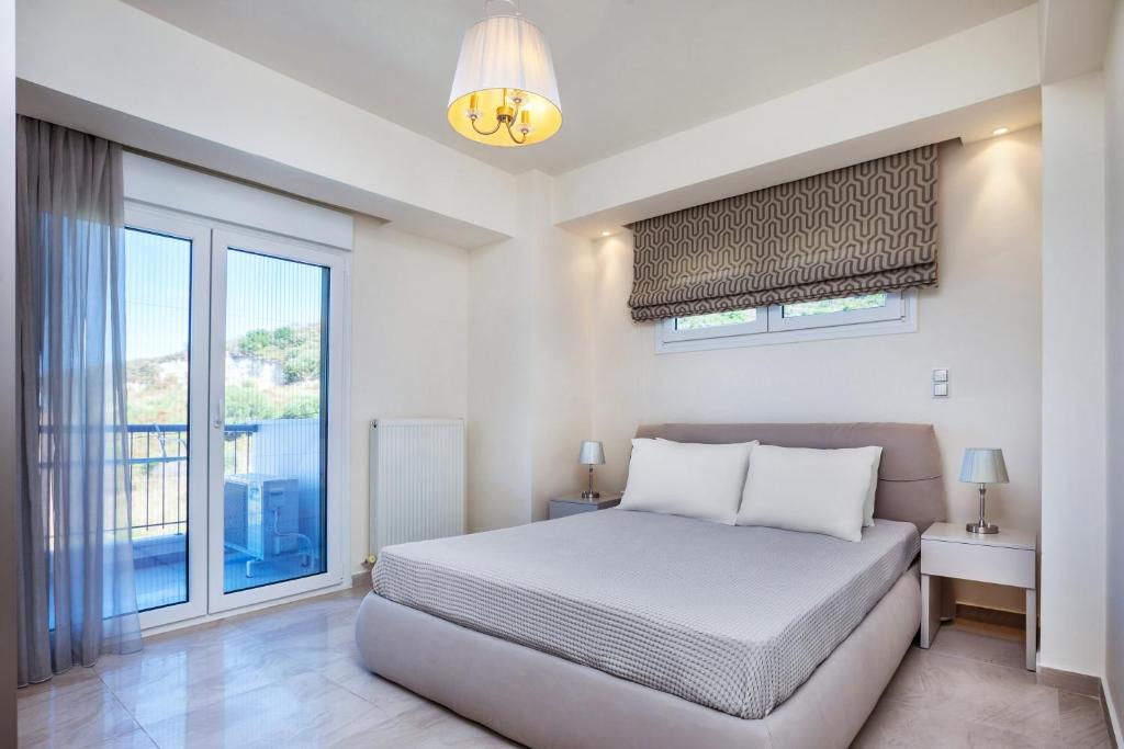 Posteľ alebo postele v izbe v ubytovaní Deluxe Villas Mira Mare