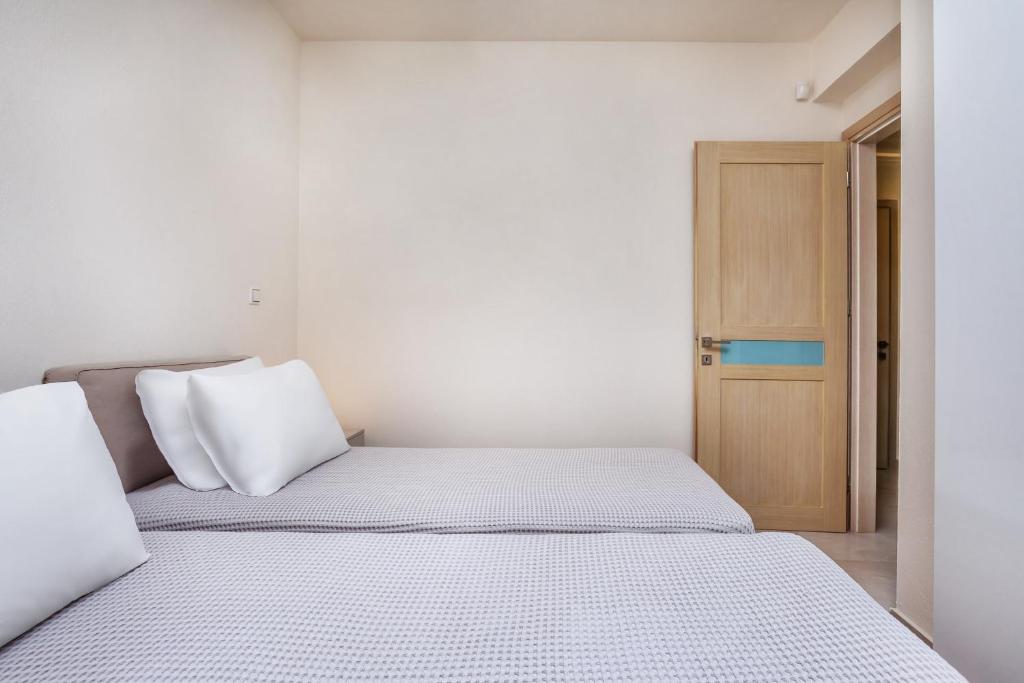 Posteľ alebo postele v izbe v ubytovaní Deluxe Villas Mira Mare