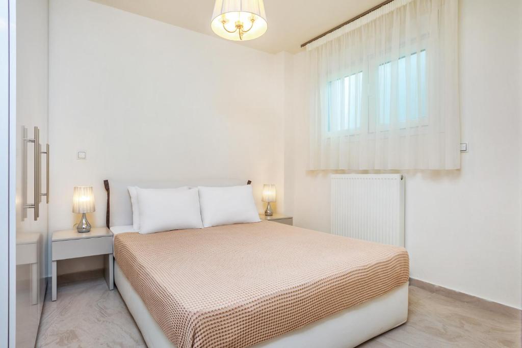 Posteľ alebo postele v izbe v ubytovaní Deluxe Villas Mira Mare