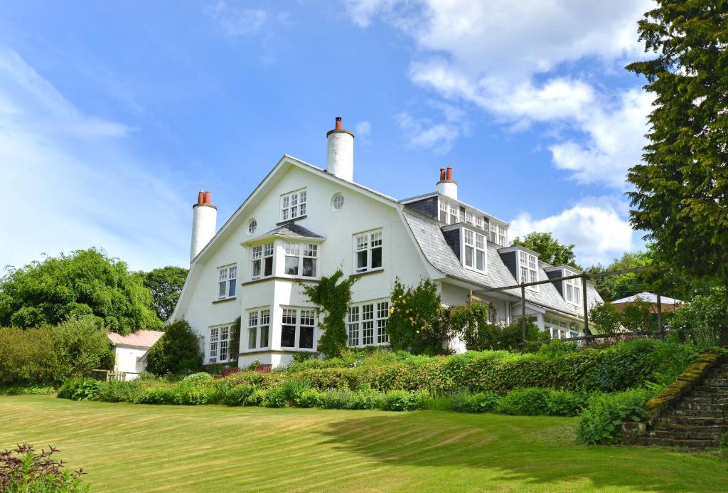 a white house with a lawn in front of it at Willowvale in Nairn