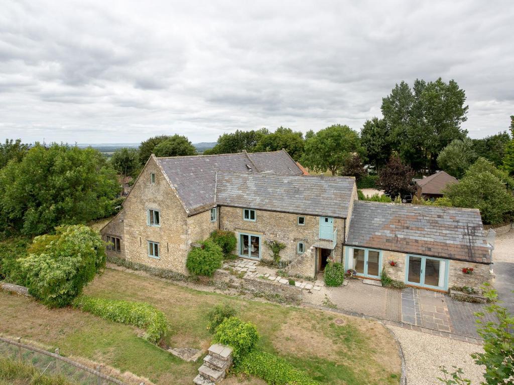 an aerial view of an old stone house at Woodcock Farm in Bristol