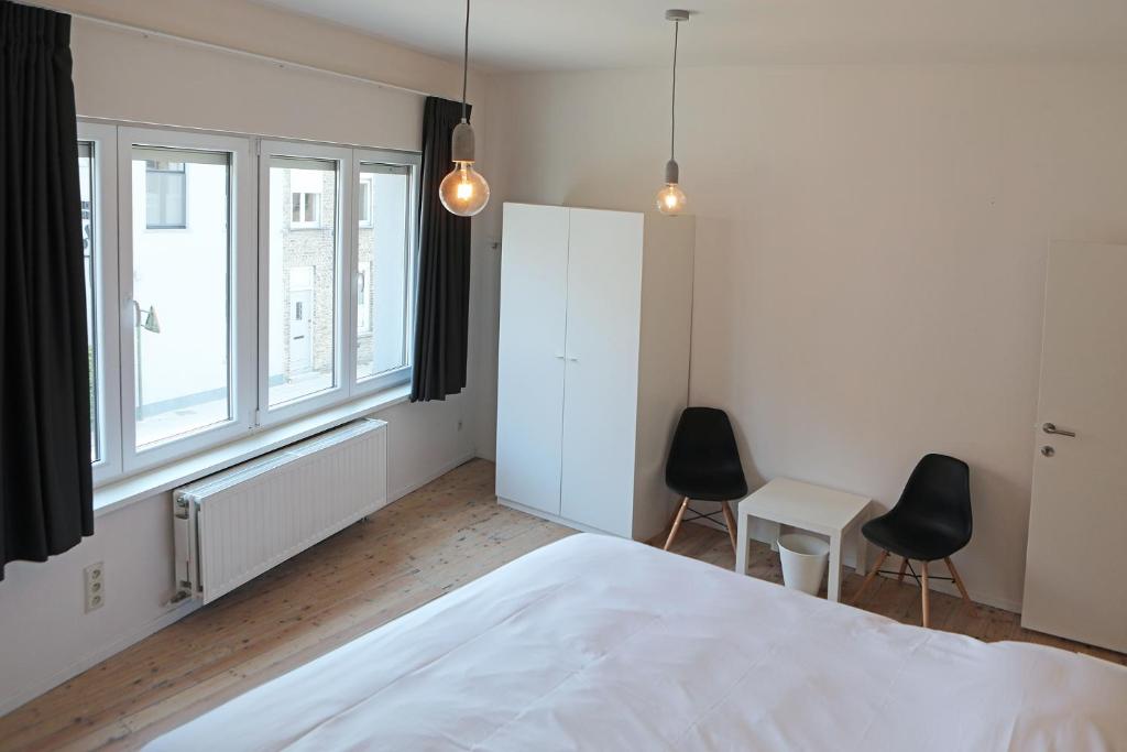 Postel nebo postele na pokoji v ubytování Hotel De Loft