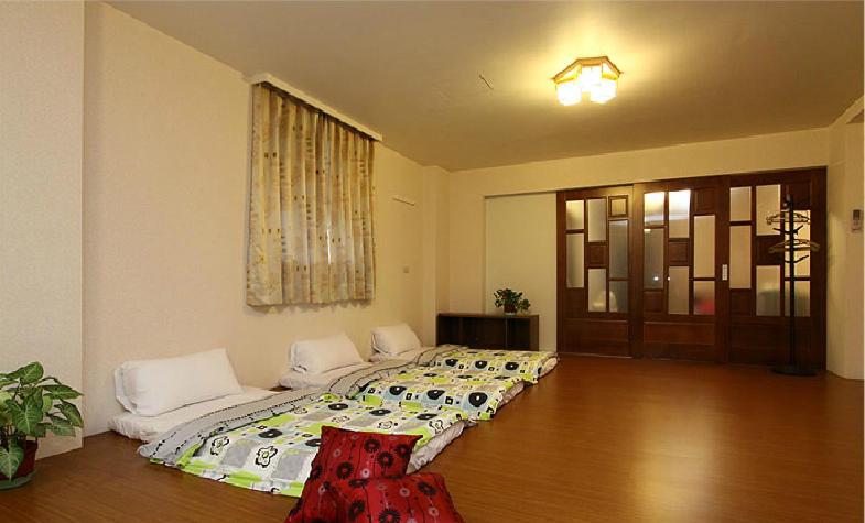 - une chambre avec 2 lits dans l'établissement Chyi's House, à Luodong