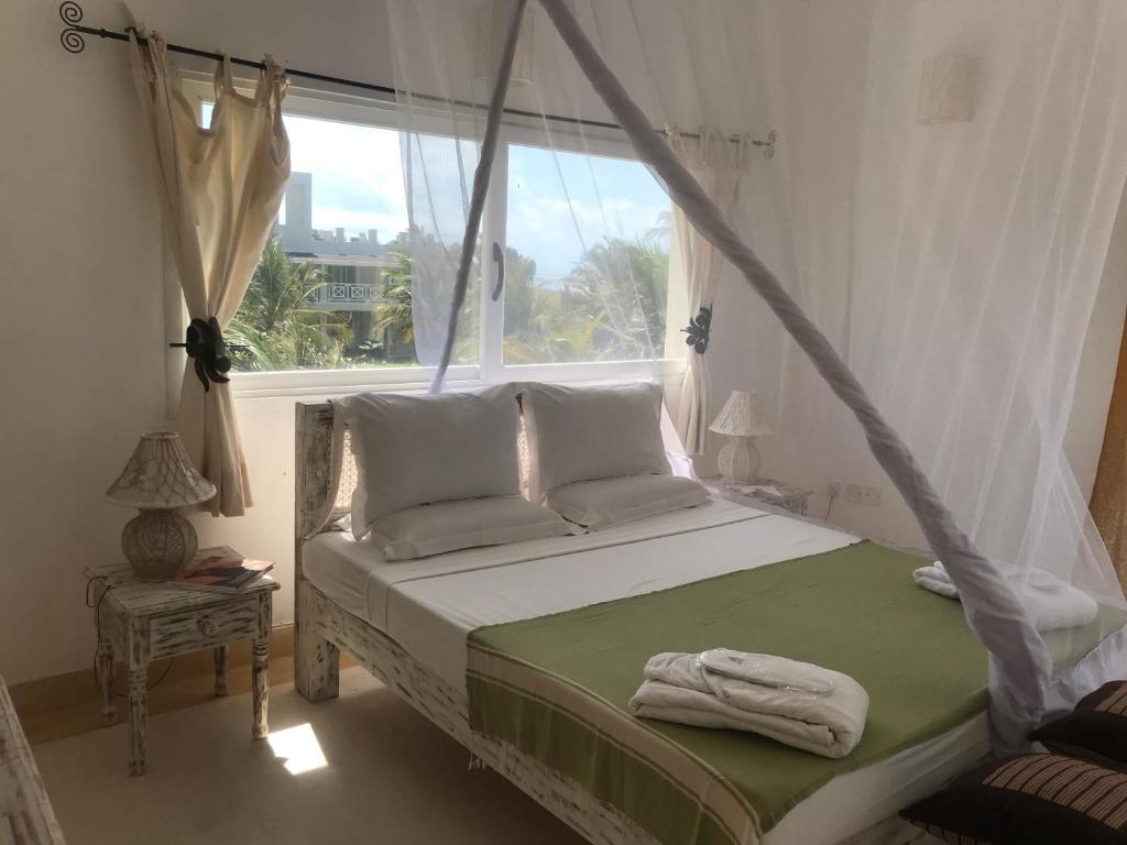 Postel nebo postele na pokoji v ubytování Life Resort St. Thomas Royal Palm