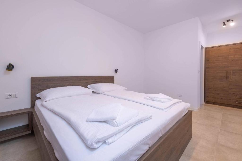 Postel nebo postele na pokoji v ubytování Holiday house Luca