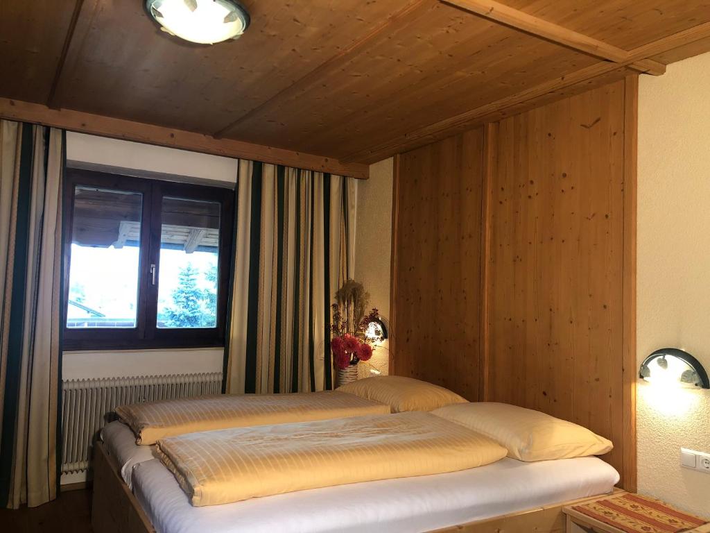 Postel nebo postele na pokoji v ubytování Ferienhof Kampfl