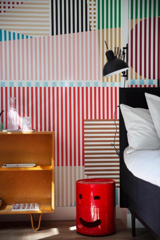 Postel nebo postele na pokoji v ubytování MUZE Hotel Utrecht