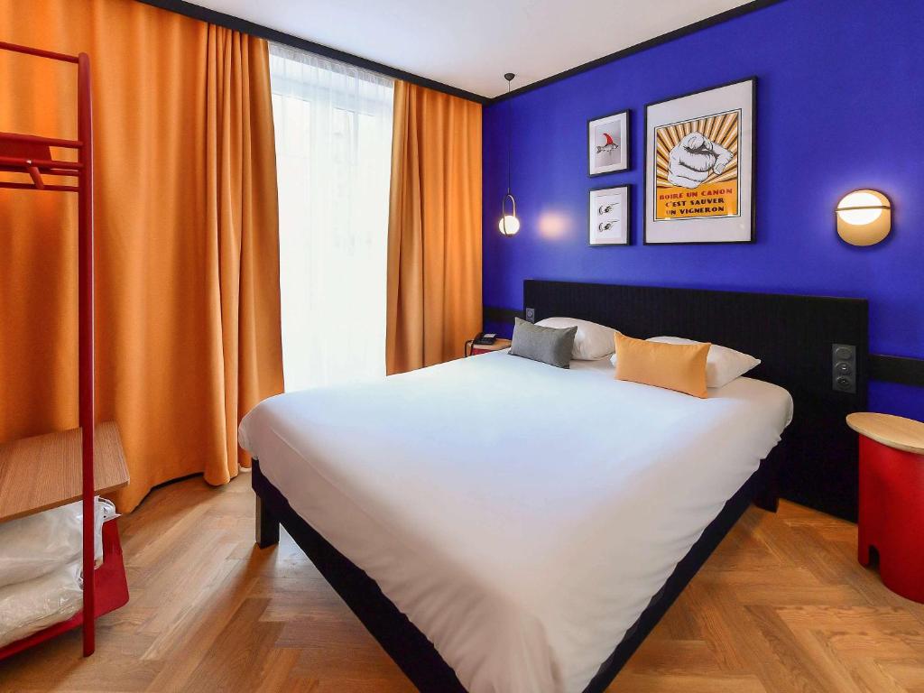 Postel nebo postele na pokoji v ubytování ibis Styles Dijon Central