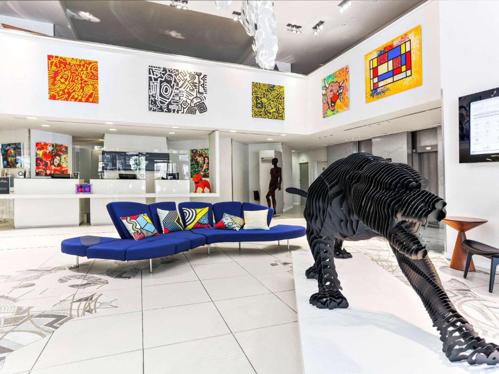 a museum with a zebra statue in the middle of a room at Pullman Toulouse Centre Ramblas in Toulouse