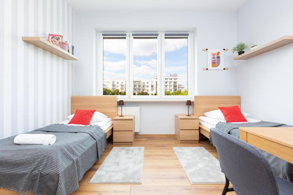 Posteľ alebo postele v izbe v ubytovaní Apartment Warsaw Puławska by Noclegi Renters
