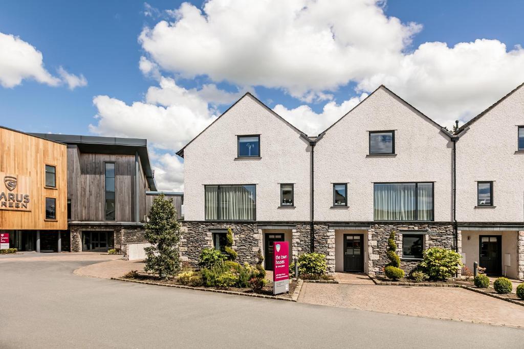 an image of a house with a building at Carus Green Golf Club Townhouse in Kendal