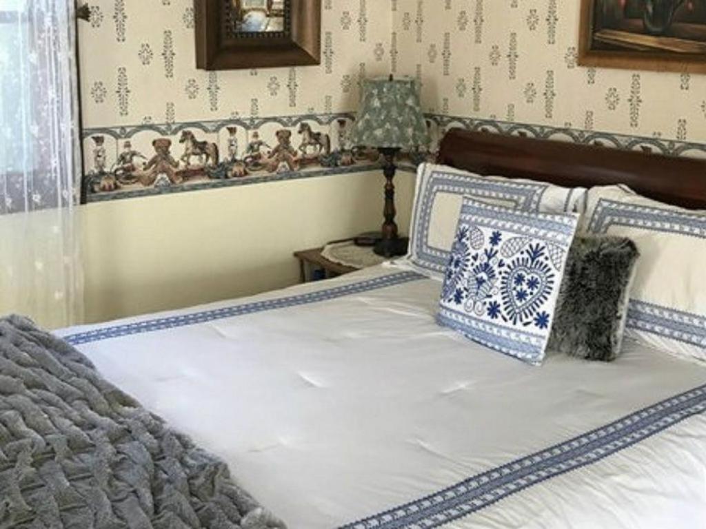Postel nebo postele na pokoji v ubytování Gardenview Bed and Breakfast