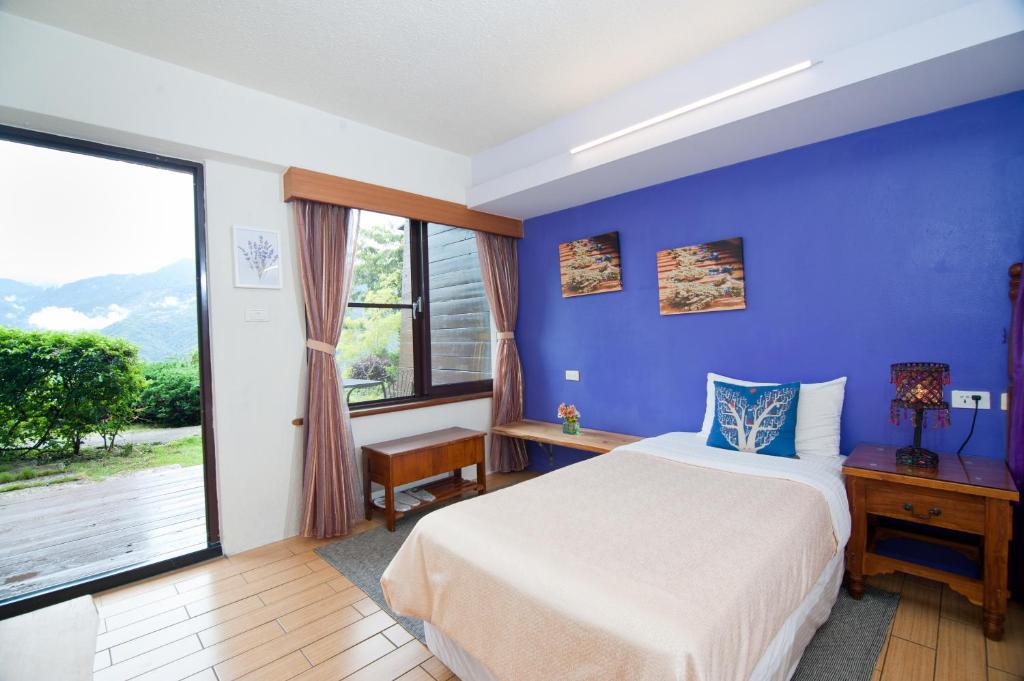 Postel nebo postele na pokoji v ubytování Margaret Garden Villa
