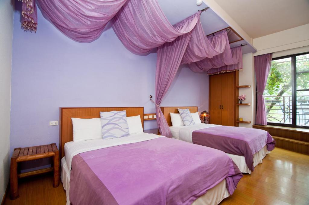 Postel nebo postele na pokoji v ubytování Margaret Garden Villa