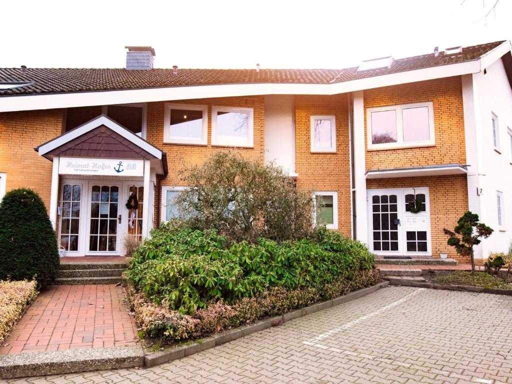 a brick house with a driveway in front of it at Heimathafen Bad Bevensen in Bad Bevensen