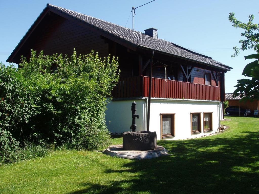 a building with a statue in front of it at Ferien im Hunsrück in Beltheim