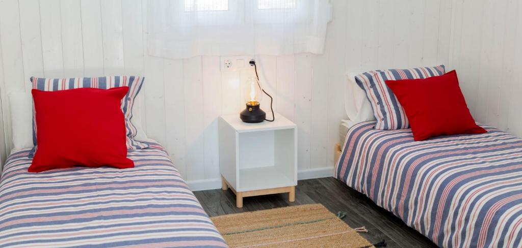 Postel nebo postele na pokoji v ubytování Cabanas de Vendaval