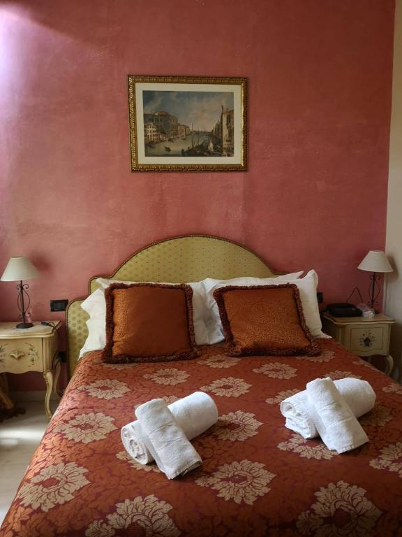 Postel nebo postele na pokoji v ubytování Hotel Villa Stella