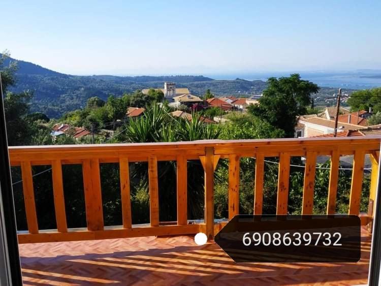 a license plate sitting on top of a wooden deck at Lefkada Villas Panoramic in Katouna