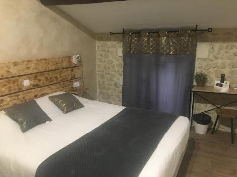 Postel nebo postele na pokoji v ubytování Le Mas de Valaurie
