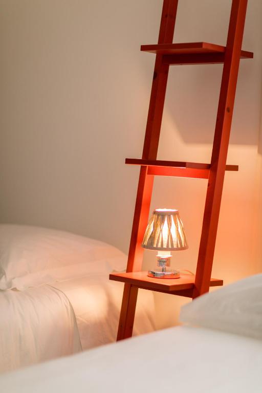 Postel nebo postele na pokoji v ubytování Hostel da Palmeira