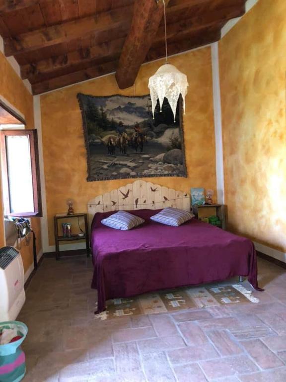 Postel nebo postele na pokoji v ubytování Bed and Breakfast Balli coi Lupi