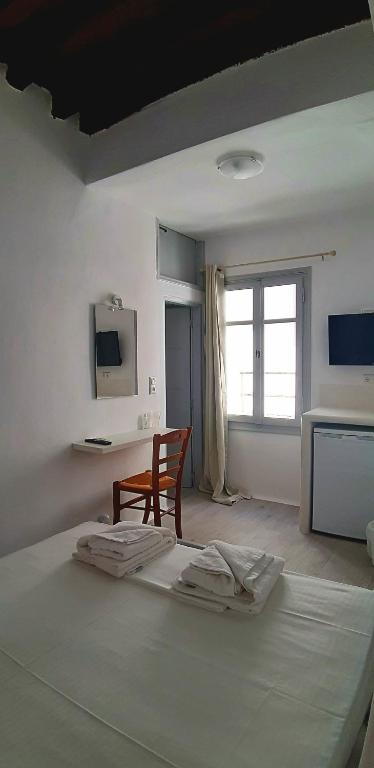 Postel nebo postele na pokoji v ubytování Castellino Naxos