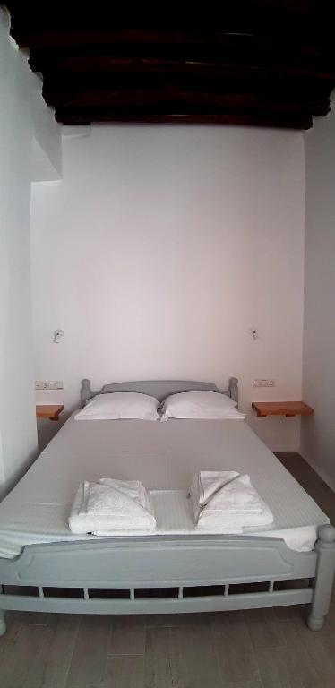 Postel nebo postele na pokoji v ubytování Castellino Naxos